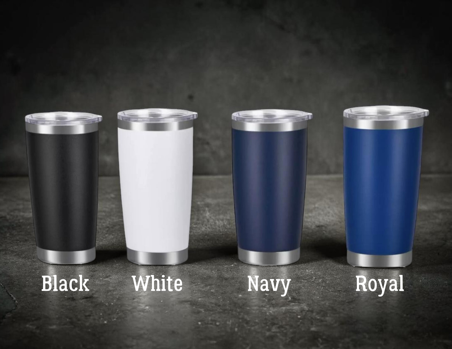 Four insulated tumblers in black, white, navy, and royal colors on a dark surface.