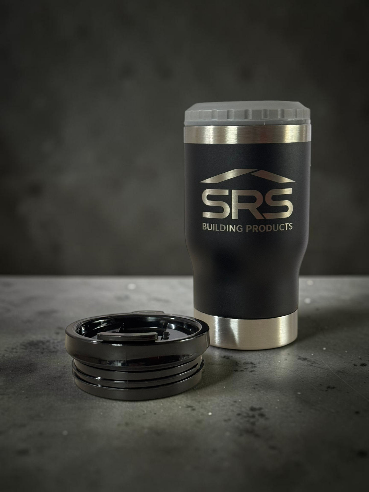 black can cooler with grey top on concrete background