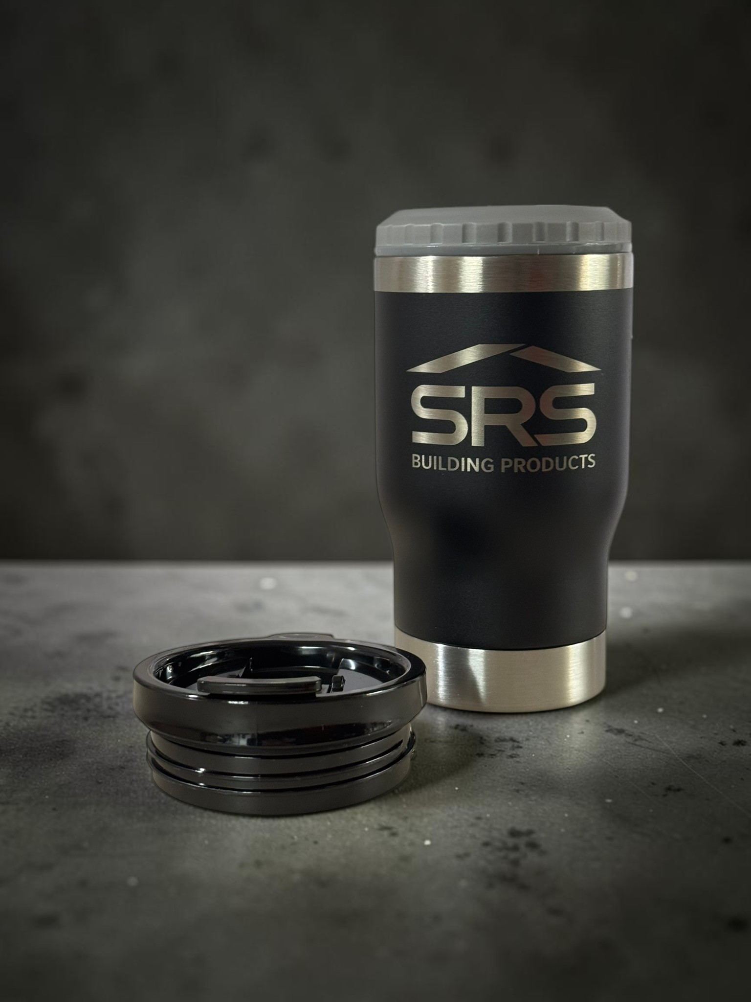 black can cooler with grey top on concrete background